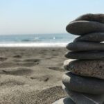Stack of stones on beach during daytime